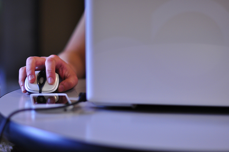 Email Marketing Hand poised over a mouse