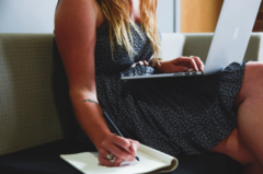 Woman Writing and Laptop